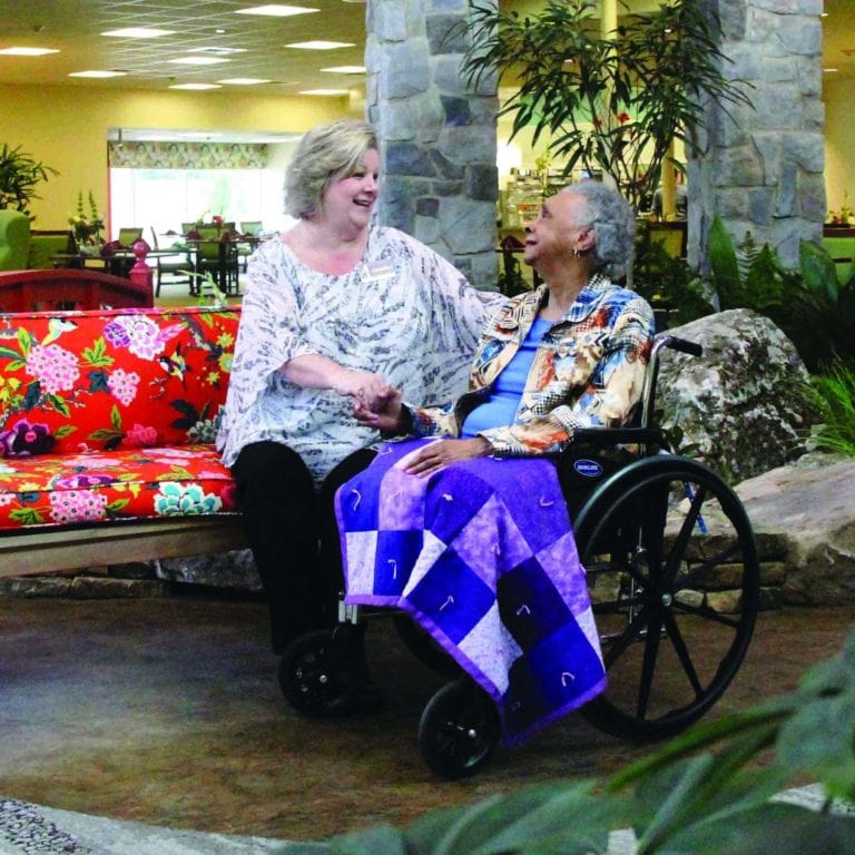 Staff with Resident in Wheelchair